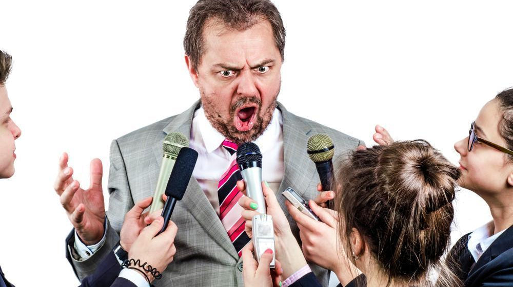 Politician with reporters